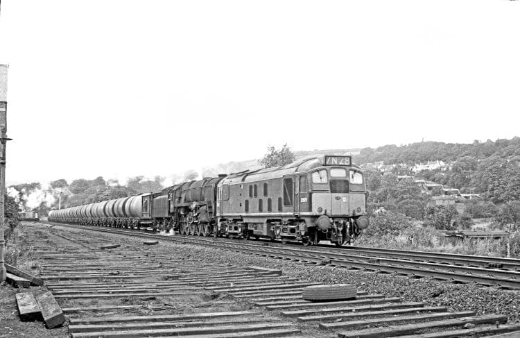 BR Sulzer Type 2 diesel D5075 and BR Standard 9F 2-10-0 No. 92118 approach Bingley with the Heysham-Neville Hill oil train on September 30, 1967. This combination of motive power continued to work this train after the end of steam in the West Riding. JOHN MARSH