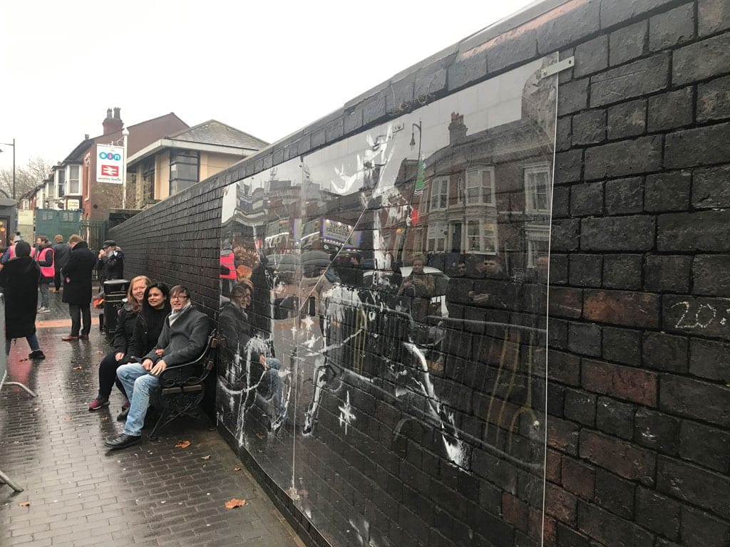 Network Rail has put a protective screen over the latest art work by world-famous street artist Banksy.