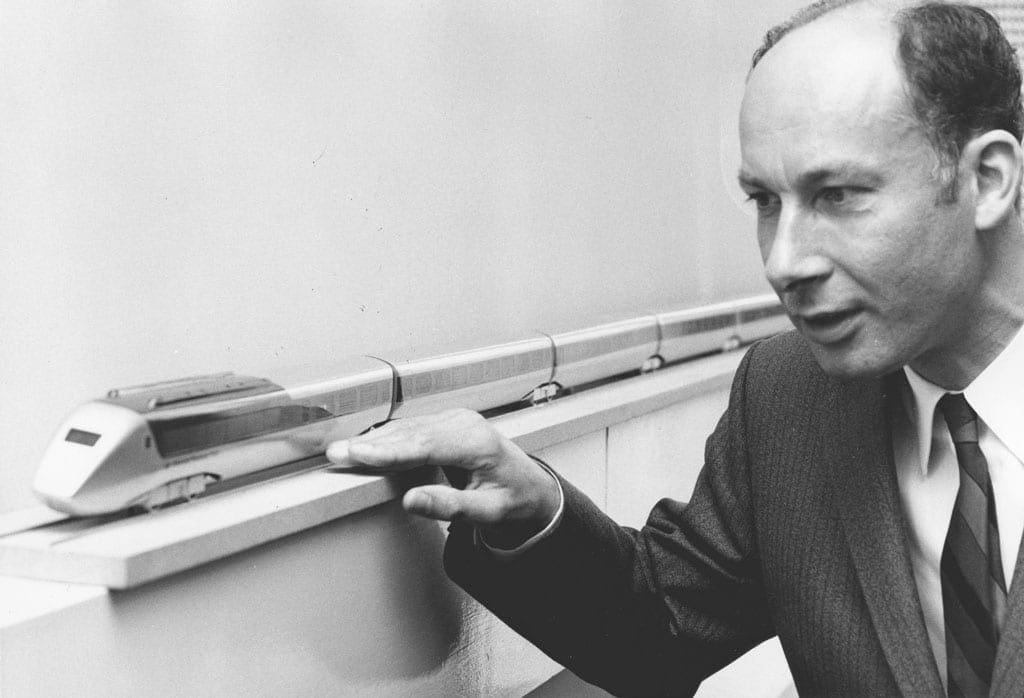 Dr Alan Wickens, head of BR Derby research c.1970 NRM Dr Alan Wickens, head of BR Derby research stood next to a model train.
