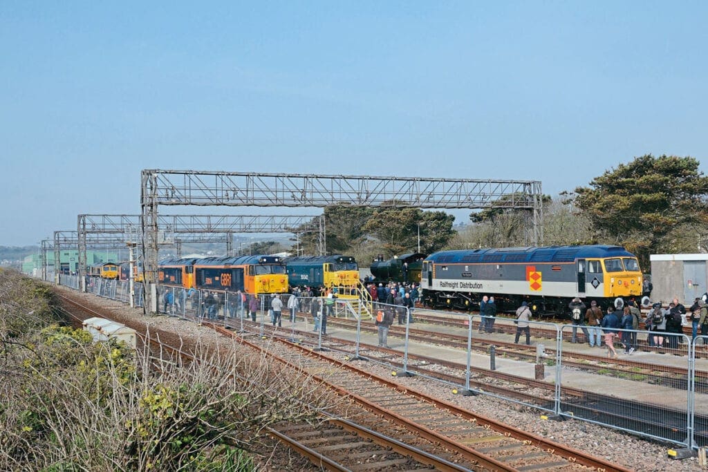 A general view of Long Rock looking west from the footpath along the adjacent sea wall, with the main line out of Penzance running this side of the temporary fence. Visible are Nos. 47306, 50007, 50049, 50042, steam loco No. 3205, 73107 and 66174.
