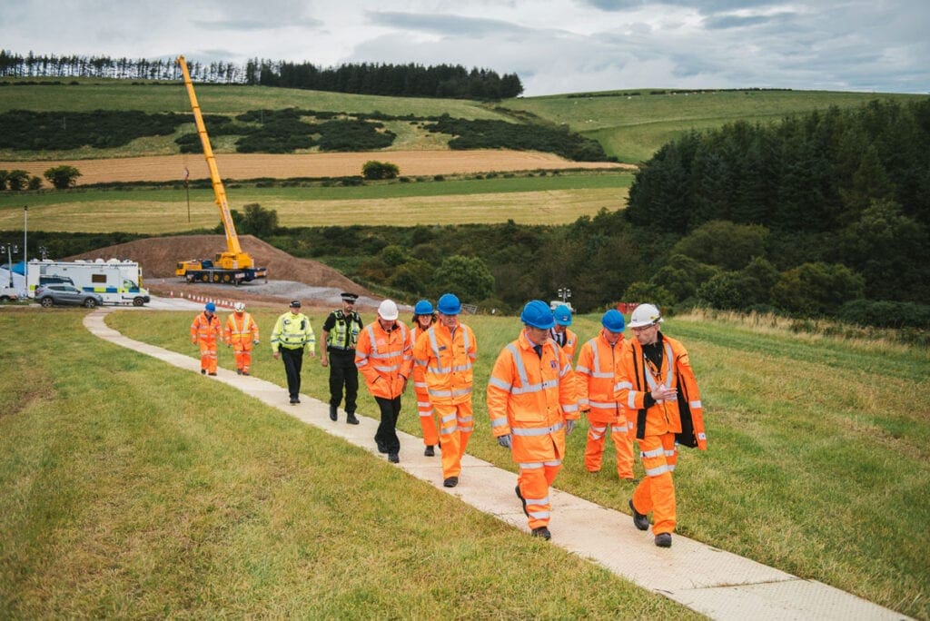Cabinet Secretary for Transport, Infrastructure and Connectivity, Michael Matheson with Network Rail workers