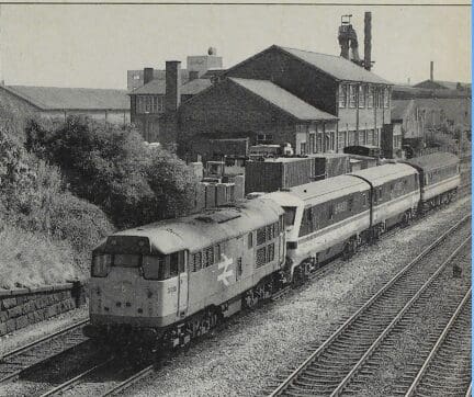 DVTs Nos. 82 109/110 make a sorry sight as, graffiti-covered, they approach Derby behind class 31 No. 31235, presumably for a repaint job, on July 4. Photo: Dr. Les Nixon.