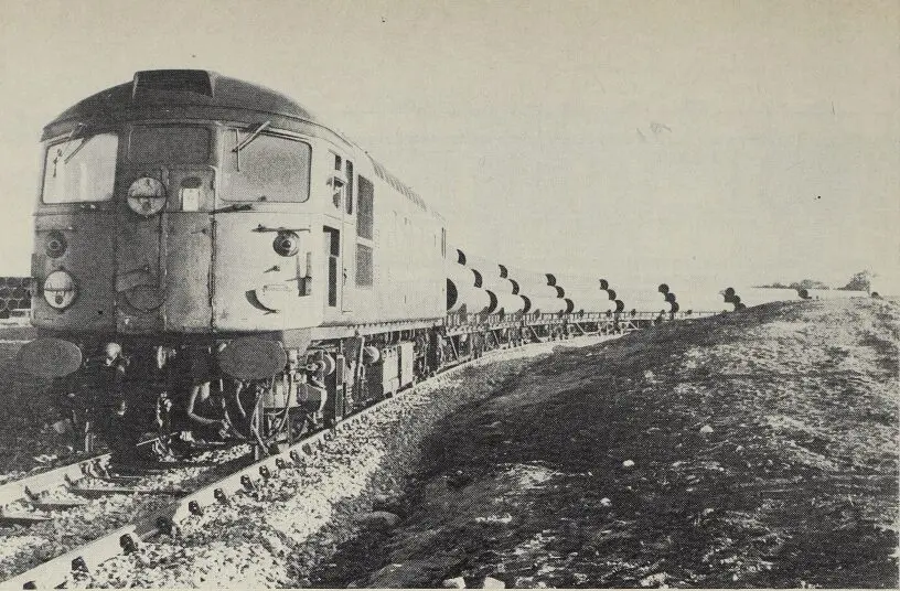 A BRCW type “2” leaves the new private siding of MK-Shand, Invergordon, with a load of 90 sections of North Sea pipeline bound for Tyneside where the pipes receive a bitumastic coating before being returned to Invergordon Photo: British Railways, Scottish Region